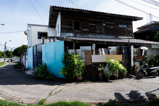 A hectic neighborhood corner in Bangkok, Thailand on a sunny day