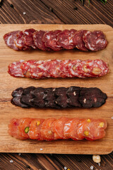 Close-up of sliced salami with nuts, gourmet meat textures and flavors, charcuterie boards