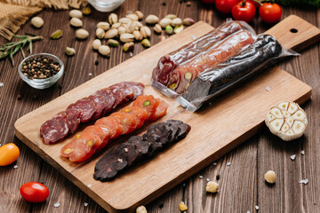 Close-up of sliced salami with nuts, gourmet meat textures and flavors, charcuterie boards