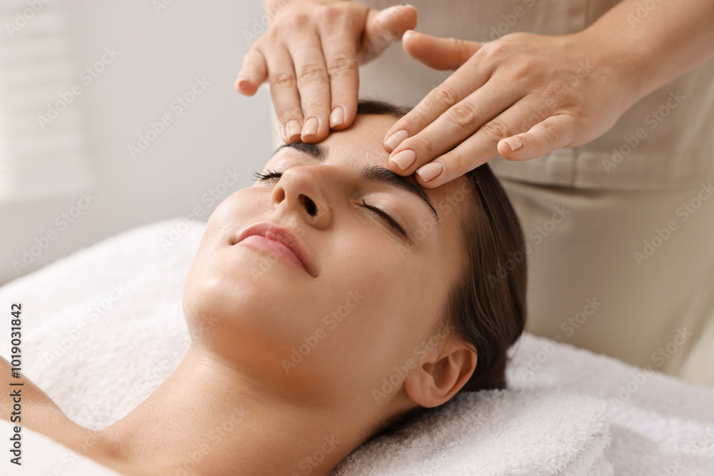 Poster Attractive woman enjoying face massage, closeup. Beauty procedure