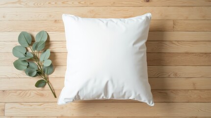 plain white square pillow on light brown wood floor