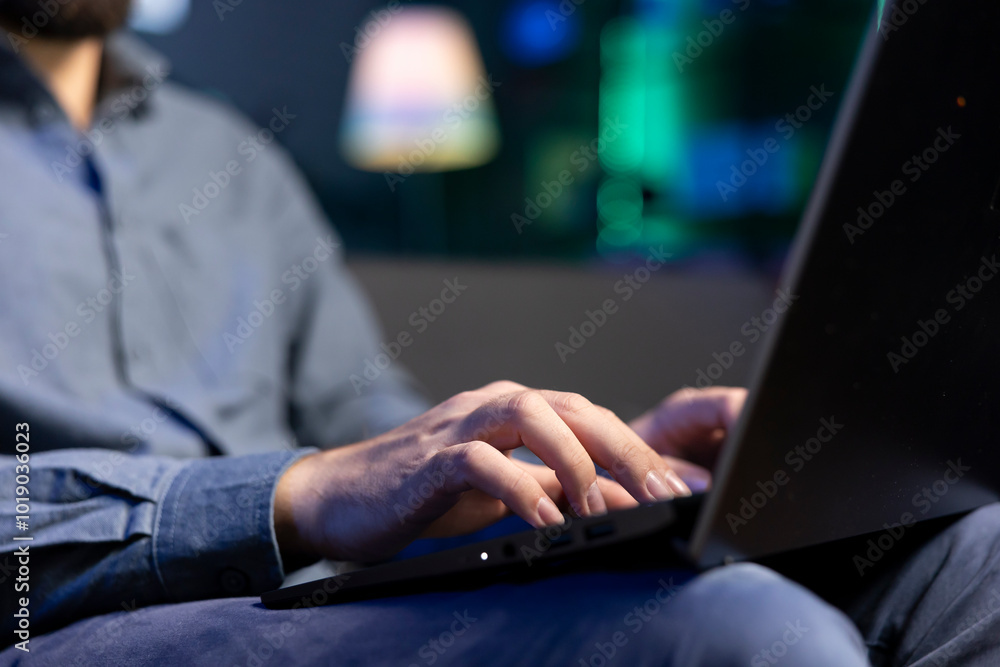 Poster freelancing man working from home, typing on laptop, surfing the net, close up shot. remote employee