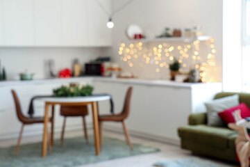 Blurred view of festive kitchen with Christmas decorations