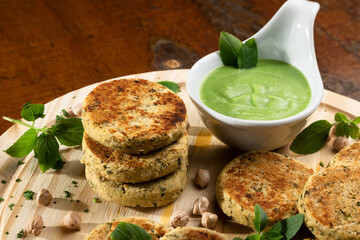 GOURMET VEGAN FALAFEL FOOD WITH WOOD TABLE RUSTIC BACKGROUND, TOP VIEW