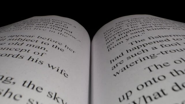 Flying over a book with a fairy tale by A. Pushkin close-up macro shot.