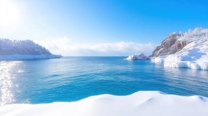 Winter coastal scenery with snow-covered rocky shoreline and icy waters