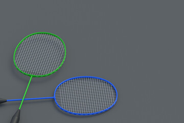 Two badminton rackets on gray background. Game for hobby and leisure. Sports equipment. Copy space. 3d render