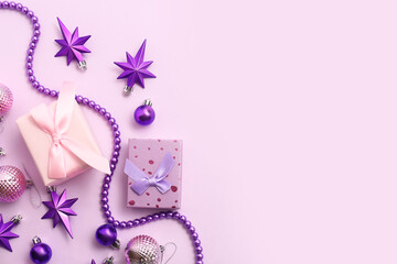 Christmas gift boxes with balls, beads and stars on purple background