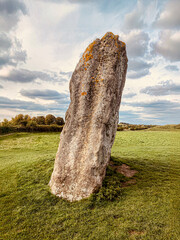 Avebury, Wiltshire, Neolithic sarsen stone leaning precariously at a stone circle.