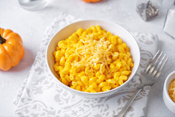 Pumpkin maccheese in a bowl on a white background