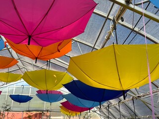 Multicolored umbrellas on the ceiling at a fair in Canada