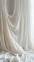 Soft white fabric drapes elegantly over a serene backdrop creating a tranquil indoor atmosphere