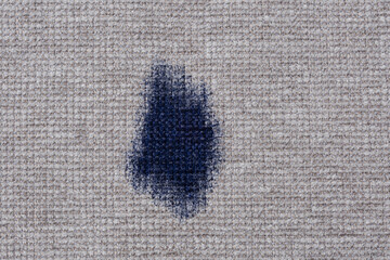 Dirty stains ink on gray upholstery of a sofa or carpet. Natural ingredients for green cleaning...