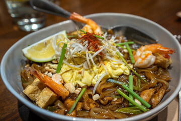 Pad Thai is a Thai noodle stir fry with a sweet-savoury-sour sauce scattered with crushed peanuts.
