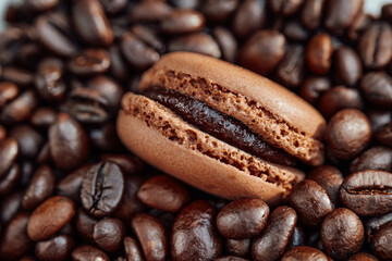 Coffee Desserts.Brown Macarons with Coffee Cream.Macaroons and roasted coffee beans.French pastries with coffee cream and aroma