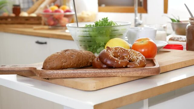 Kitchen background home interior bright simple decorate with bread garlic apple oil Preparing food meal. Warm home interior defocused mockup food shelf living space. Home showcase kitchen restaurant