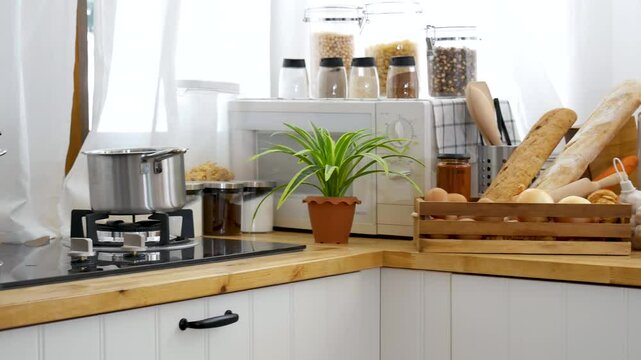 Kitchen background home interior bright simple decorate with bread garlic apple oil Preparing food meal. Warm home interior defocused mockup food shelf living space. Home showcase kitchen restaurant