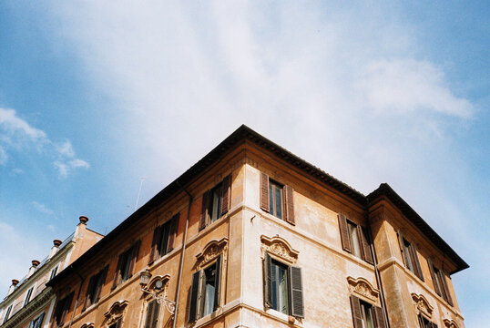 Film photography of facade of residential building under sky