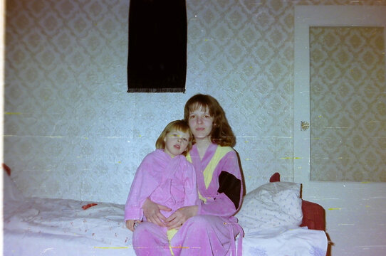 sisters in pink robes 