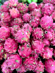 Fototapeta premium Stacked of Fresh Dragon Fruit at Supermarket