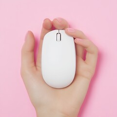 A hand holding a white computer mouse against a pink background.