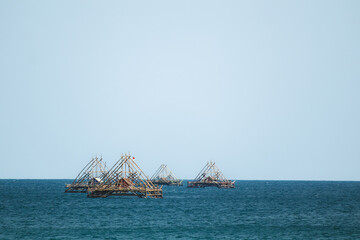A Floating Bagan in the Midst of Blue Waters. Breathtaking Summer Beach with Crystal Blue Waters. Traditional fish aggregating device, bamboo fish trap.