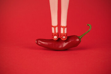 Chili Pepper Heels: Bold Red Fashion Statement Against Vibrant Background