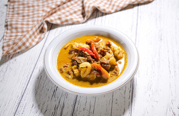 Tongseng kambing is an Indonesian goat meat, mutton or beef stew dish in curry-like soup