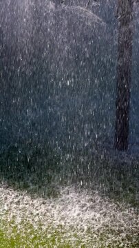 Heavy Water Spray Falling on Pond