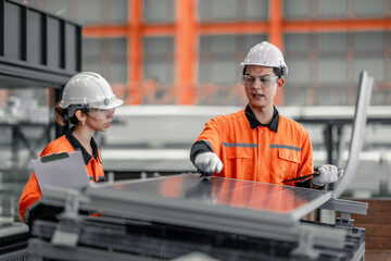 Factory metal workers install solar panels, cut costs, earn carbon credits, combat climate change.