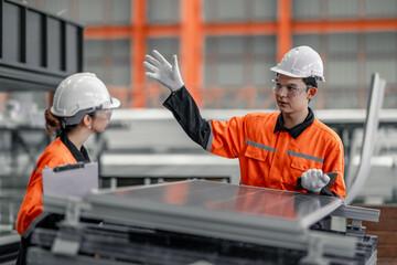 Factory metal workers install solar panels, cut costs, earn carbon credits, combat climate change.