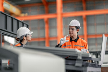 Factory metal workers install solar panels, cut costs, earn carbon credits, combat climate change.