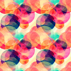 Vibrant abstract pattern with overlapping circles in vibrant shades of red, orange, yellow and turquoise. Seamless background