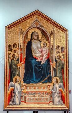 Uffizi Gallery, Florence, Italy - June 20, 2024: Madonna of Ognissanti - altar painting 1306-1310 by Giotto di Bondone was intended for the main altar of the church of Ognissanti in Florence.