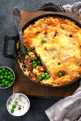 Shepherd’s Pie - ground meat with vegetables, topped with mashed potatoes, and cheese. Baked.