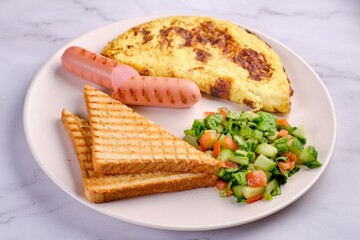 Breakfast Plate with Eggs, Vegetables, and Sausages