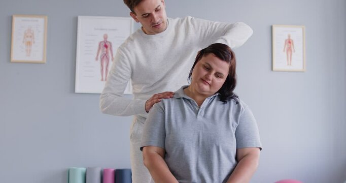 Neck massage for obese fat woman, manual therapy rehabilitation, physical therapist doing manipulative therapy, medical session to relieve tension, reduce headaches, body health, sport, wellness