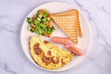 Breakfast Plate with Eggs, Vegetables, and Sausages