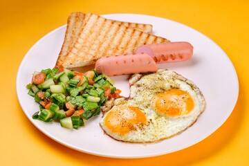 Breakfast Plate with Eggs, Vegetables, and Sausages