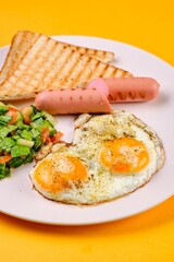 Breakfast Plate with Eggs, Vegetables, and Sausages