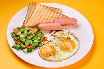 Breakfast Plate with Eggs, Vegetables, and Sausages