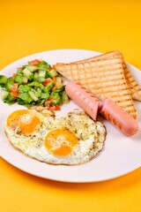 Breakfast Plate with Eggs, Vegetables, and Sausages