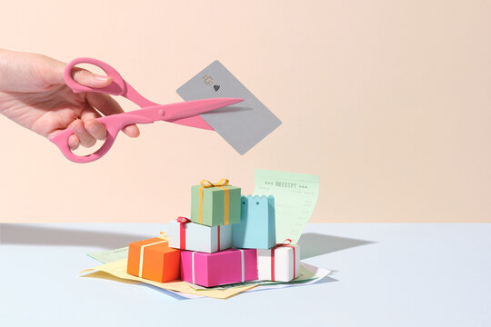 Cutting Credit Card Debt with Scissors and Gift Boxes