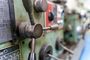 Closeup and crop old model lathe and drilling machine in industrial.