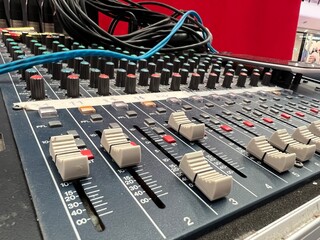 Closeup and crop of knobs with button of sound music mixer control panel.