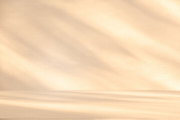 Obraz premium Wall interior background, studio and backdrops show products. with leaf shadow from window color beige and white. background for text insertion and presentation of produc