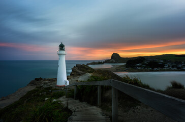 Castlepoint lighthouse and Castle Rock at sunset. Wairarapa. New Zealand.