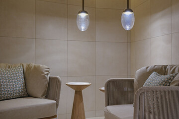 Thermal suite with heated loungers in mosaic tile design or relaxation chairs in spa or wellness...