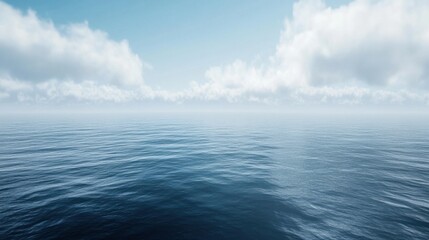 Obraz premium A serene ocean view with low clouds hanging over the water, creating a peaceful atmosphere.