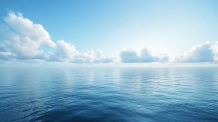 A serene ocean view with low clouds hanging over the water, creating a peaceful atmosphere.